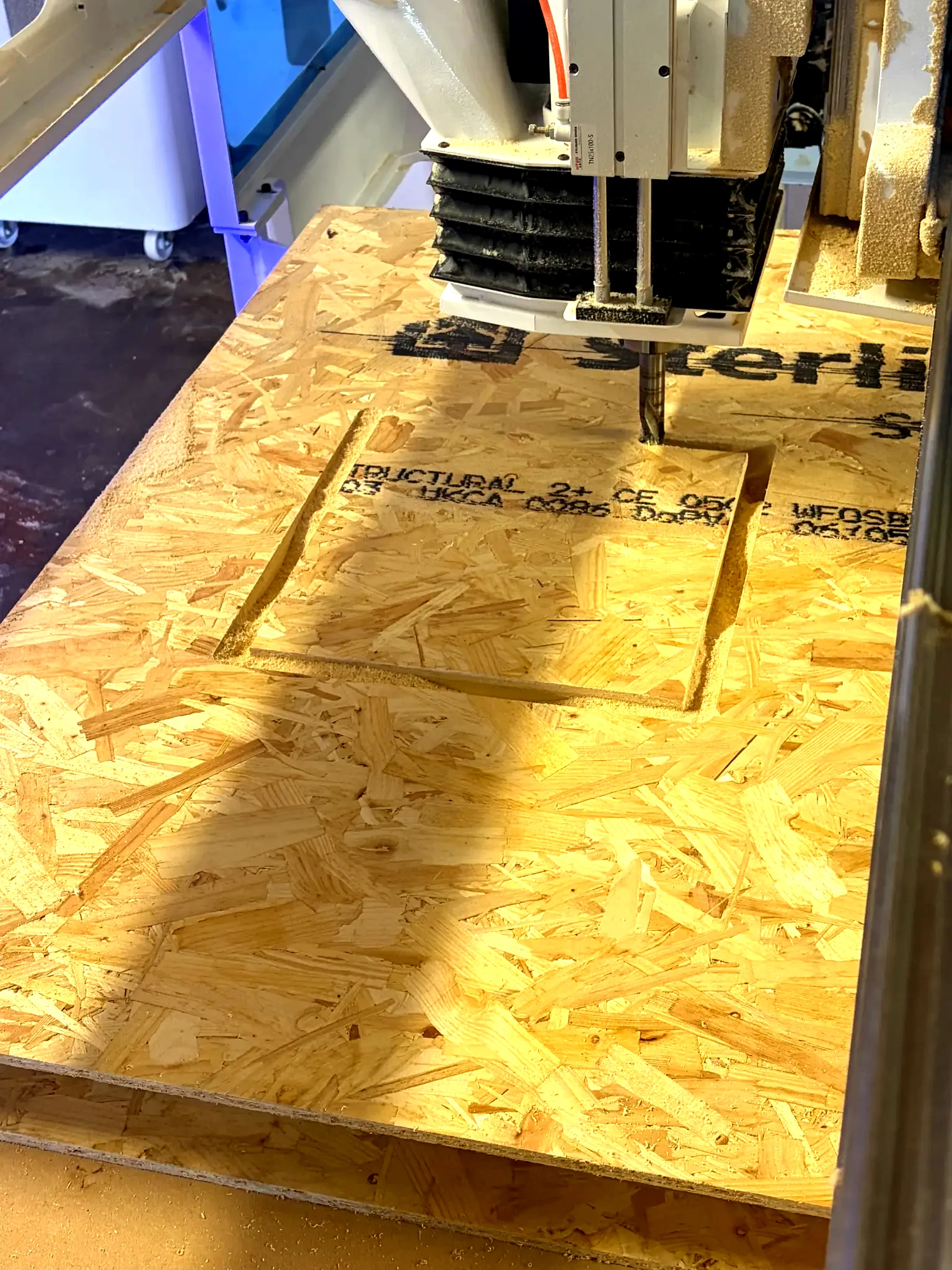 CNC cutting a circular window opening in a SIP panel
